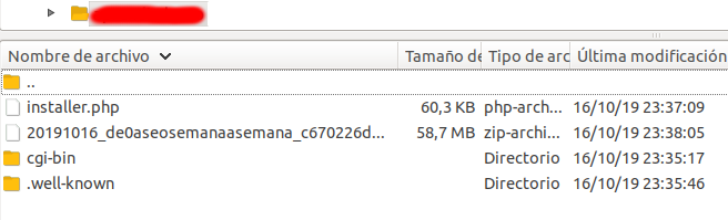Vista de los ficheros del duplicator del wordpress a migrar en el gestor de FTP filezilla